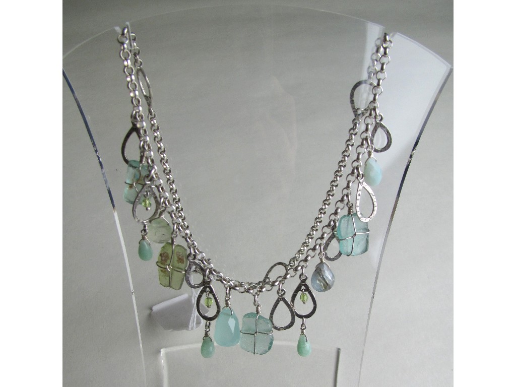 Appraisal: Contemporary silver necklace with a fringe of opalescent green beads