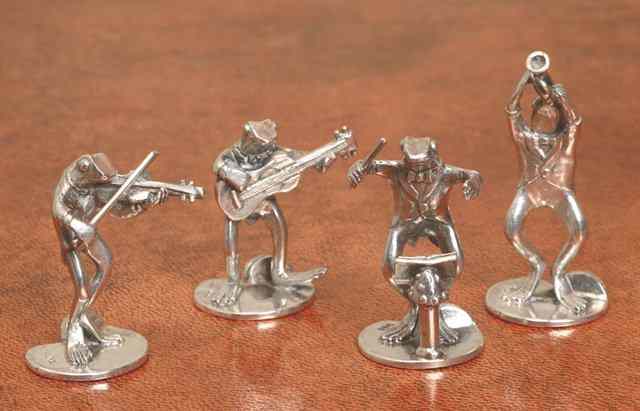 Appraisal: A SET OF FOUR SILVER 'FROG BAND' MENU HOLDERS consisting