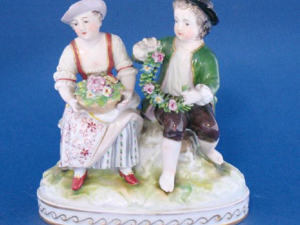 Appraisal: A CONTINENTAL PORCELAIN GROUP of three figures engaged in wine