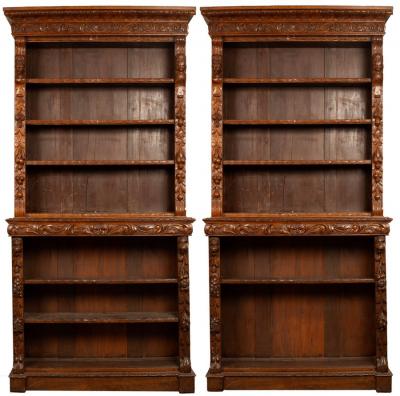 Appraisal: A pair of Jacobean Revival oak open bookcases the upper