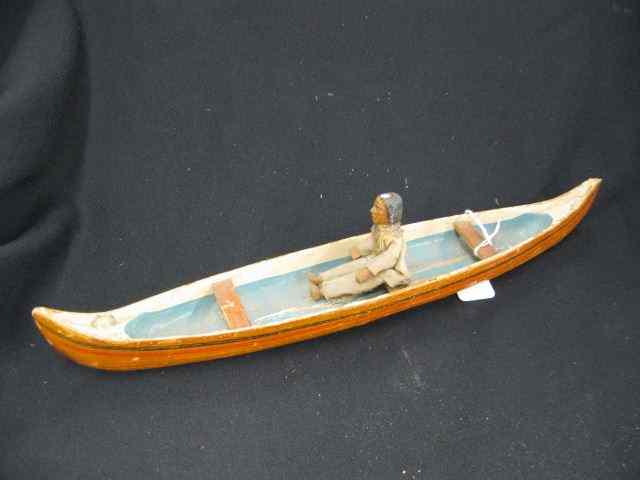 Appraisal: Carved Wooden Canoe with Indian seated original paint '' long