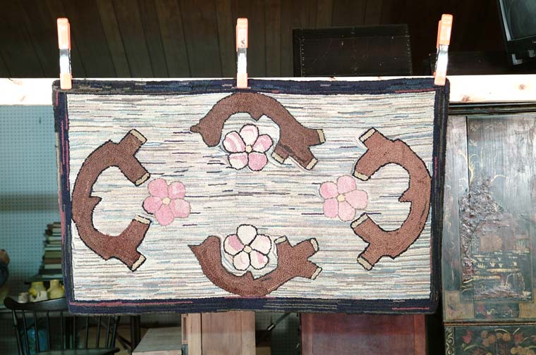 Appraisal: FOLK ART DOGWOOD HOOKED RUG Pink flowers with branches of