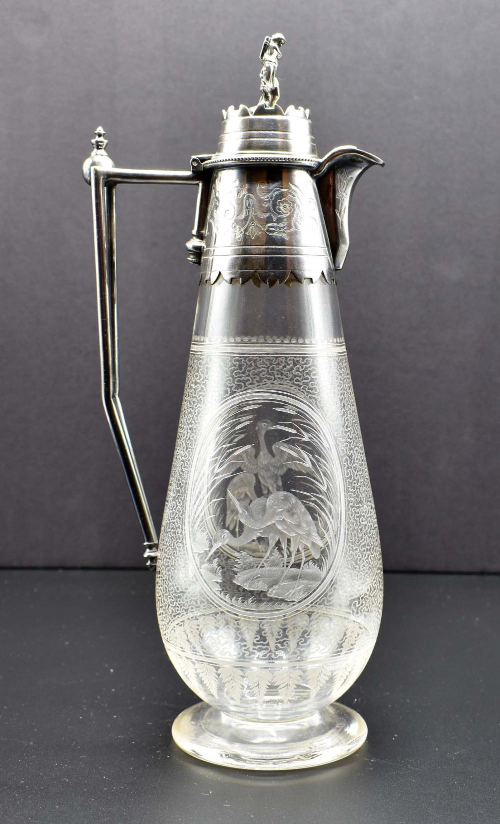 Appraisal: AESTHETIC MOVEMENT SILVER PLATE MOUNTED GLASS DECANTEREnglish Circa The silver