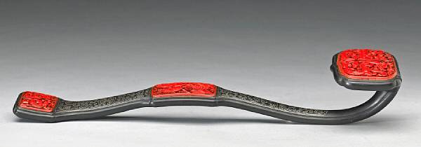 Appraisal: A silver-inlaid wood ruyi scepter with cinnabar plaques th Century