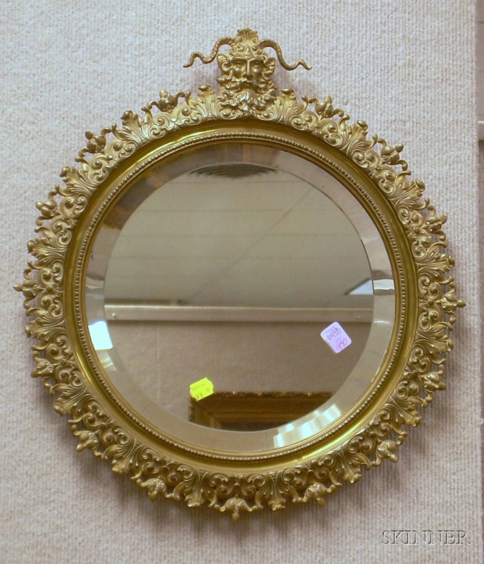 Appraisal: Late Victorian Circular Cast Brass Mirror with Beveled Glass dia