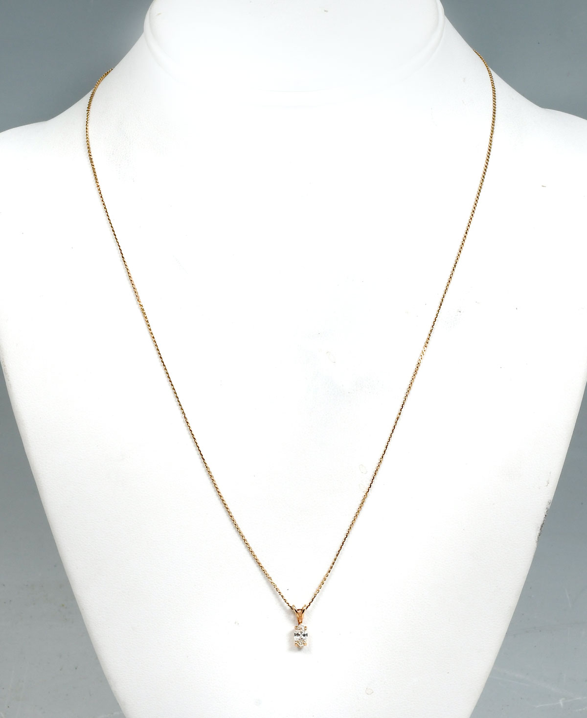 Appraisal: K DIAMOND NECKLACE K yellow gold pendant contains one marquise