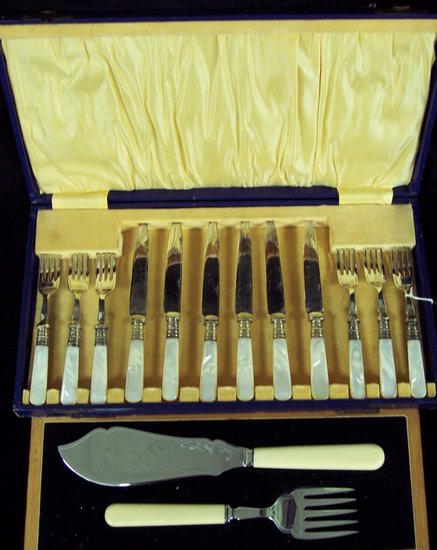 Appraisal: Six pairs of dessert knives and forks with mother-of-pearl handles