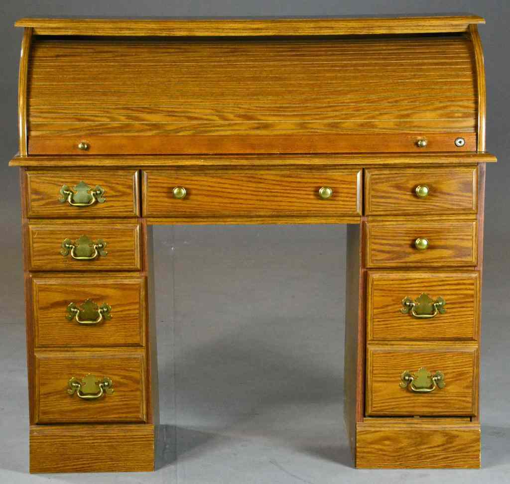 Appraisal: Roll-top Desk - Riverside FurnitureHaving a center drawer and six