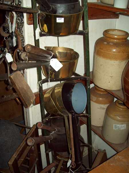 Appraisal: A VICTORIAN POT STAND WITH THIRTEEN BRASS POTS AND CAST