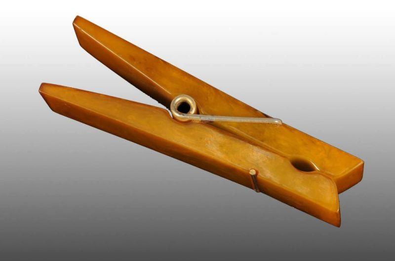 Appraisal: Oversized Bakelite Clothes Pin Clip Description Circa Condition Excellent Size