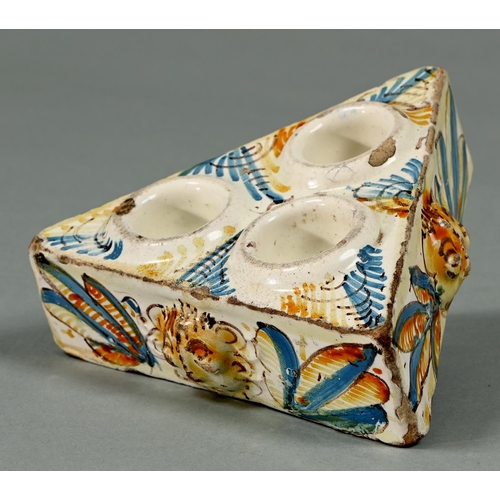 Appraisal: A Spanish faience triangular condiment stand especiero Puento del Arzobispo