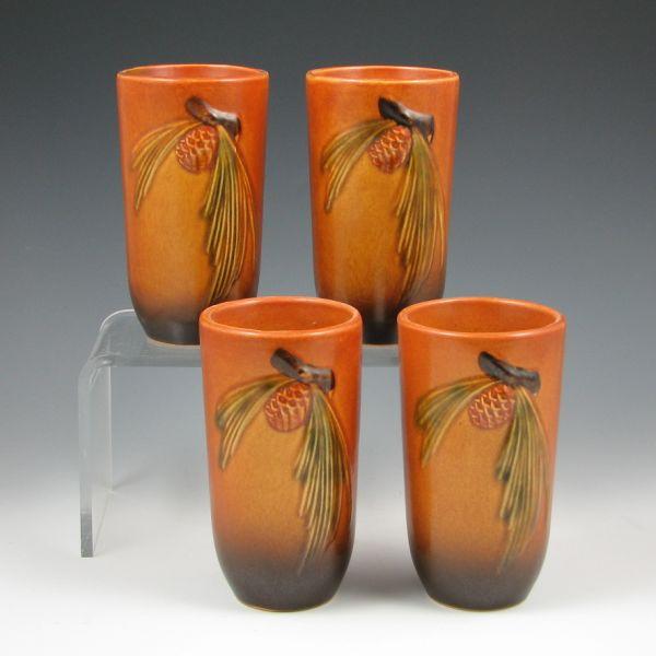 Appraisal: Four Roseville Pine Cone tumblers in brown Marked Roseville USA