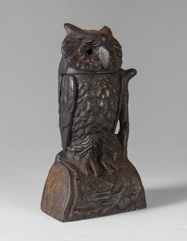 Appraisal: CAST IRON MECHANICAL OWL BANK Owl on log when button