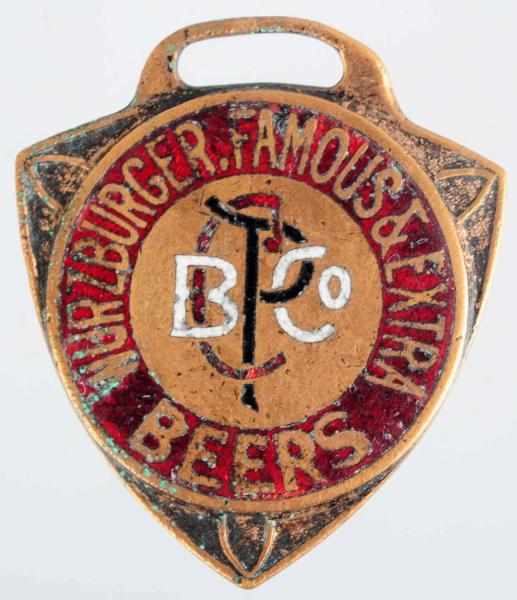 Appraisal: Wurzburger Beer Enamaled Shield Fob Heavier wear and scratching throughout