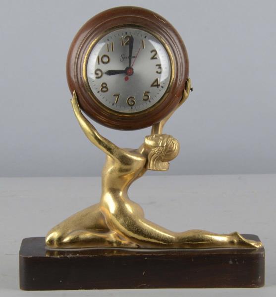 Appraisal: Art Deco Golden Woman Clock on Pedestal Women is holding