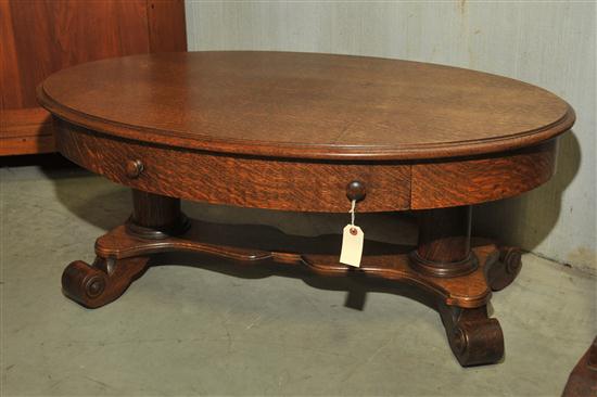 Appraisal: SIDE TABLE Oval oak table with single drawer cylindrical columns