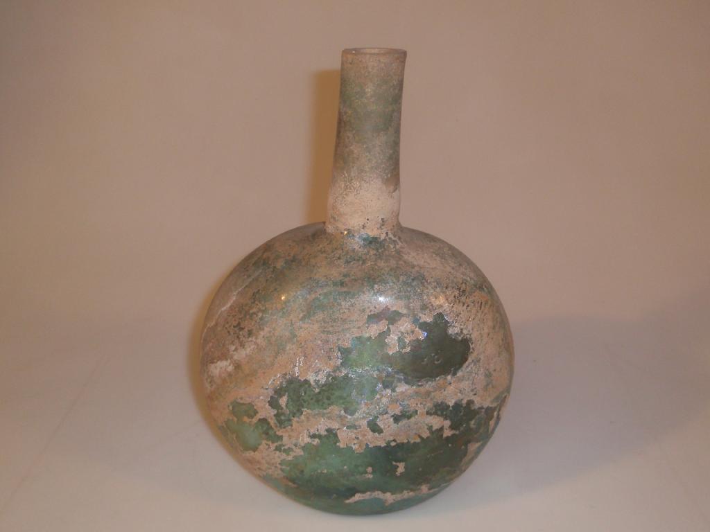 Appraisal: A very large thick-walled bluish-green post-Roman glass bottle the cut-off