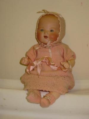 Appraisal: An Armand Marseille bisque head baby doll with blue glass