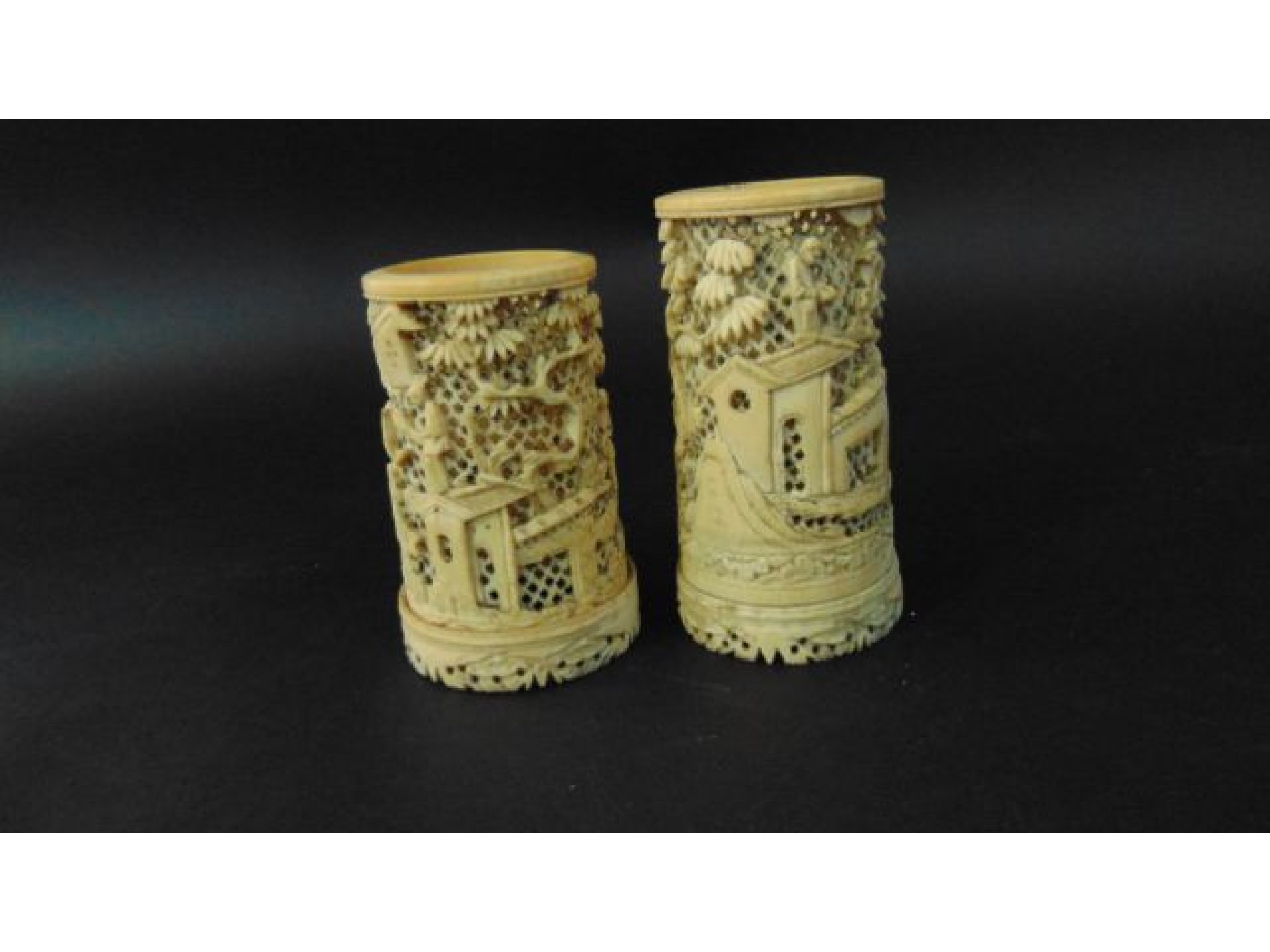 Appraisal: A pair of th century Chinese ivory vases with extensive