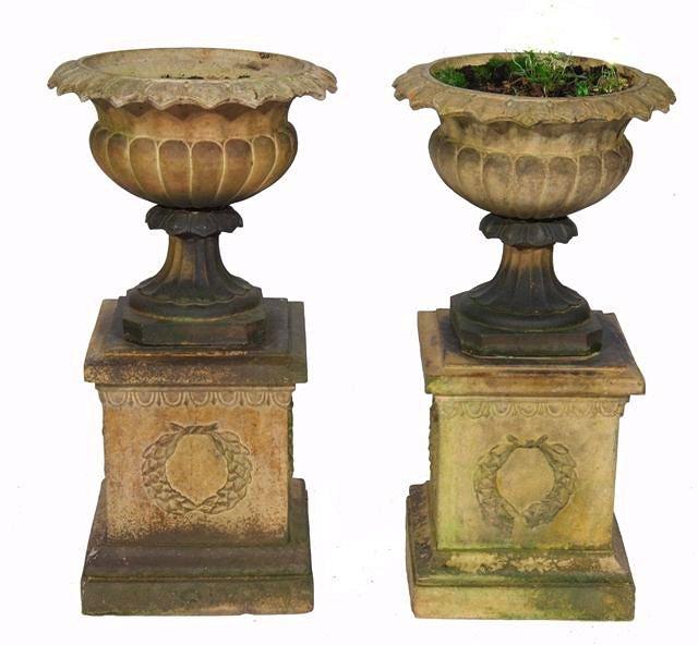 Appraisal: A PAIR OF VICTORIAN ITALIANATE STONEWARE GARDEN URNS of campagna