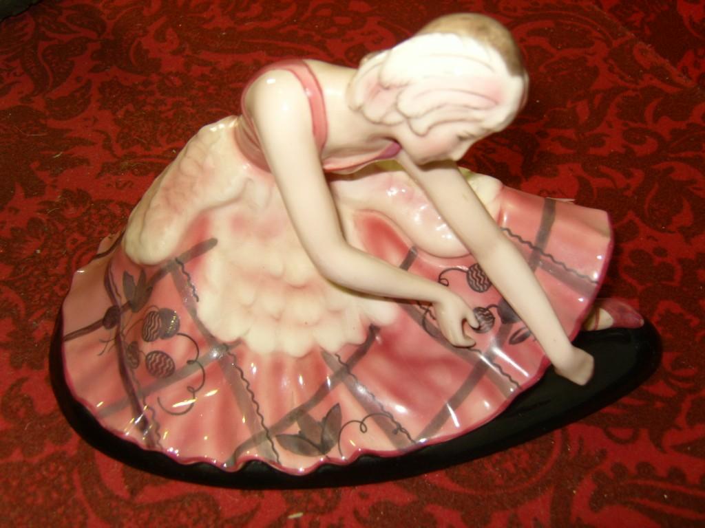 Appraisal: An Austrian Goldscheider figure of a seated ballerina in pink