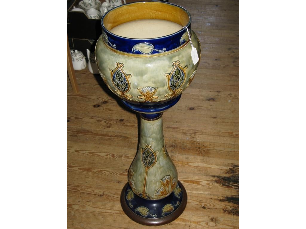 Appraisal: A Royal Doulton stoneware jardiniere on pedestal moulded with plants