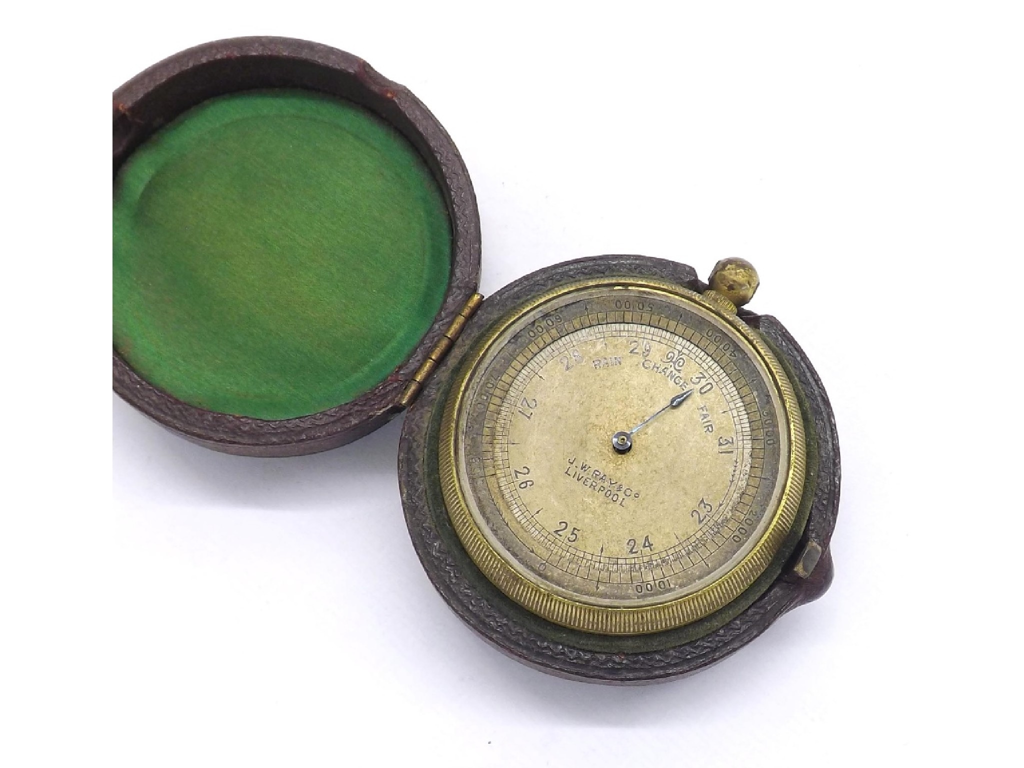 Appraisal: Brass cased aneroid pocket barometer the dial signed J W