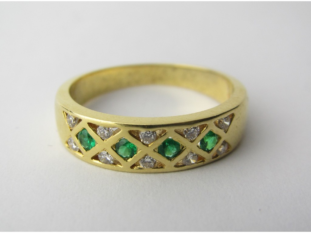 Appraisal: Eighteen carat gold emerald and diamond set band with four