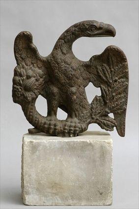 Appraisal: CAST IRON EAGLE-FORM FINIAL On associated stone plinth in overall