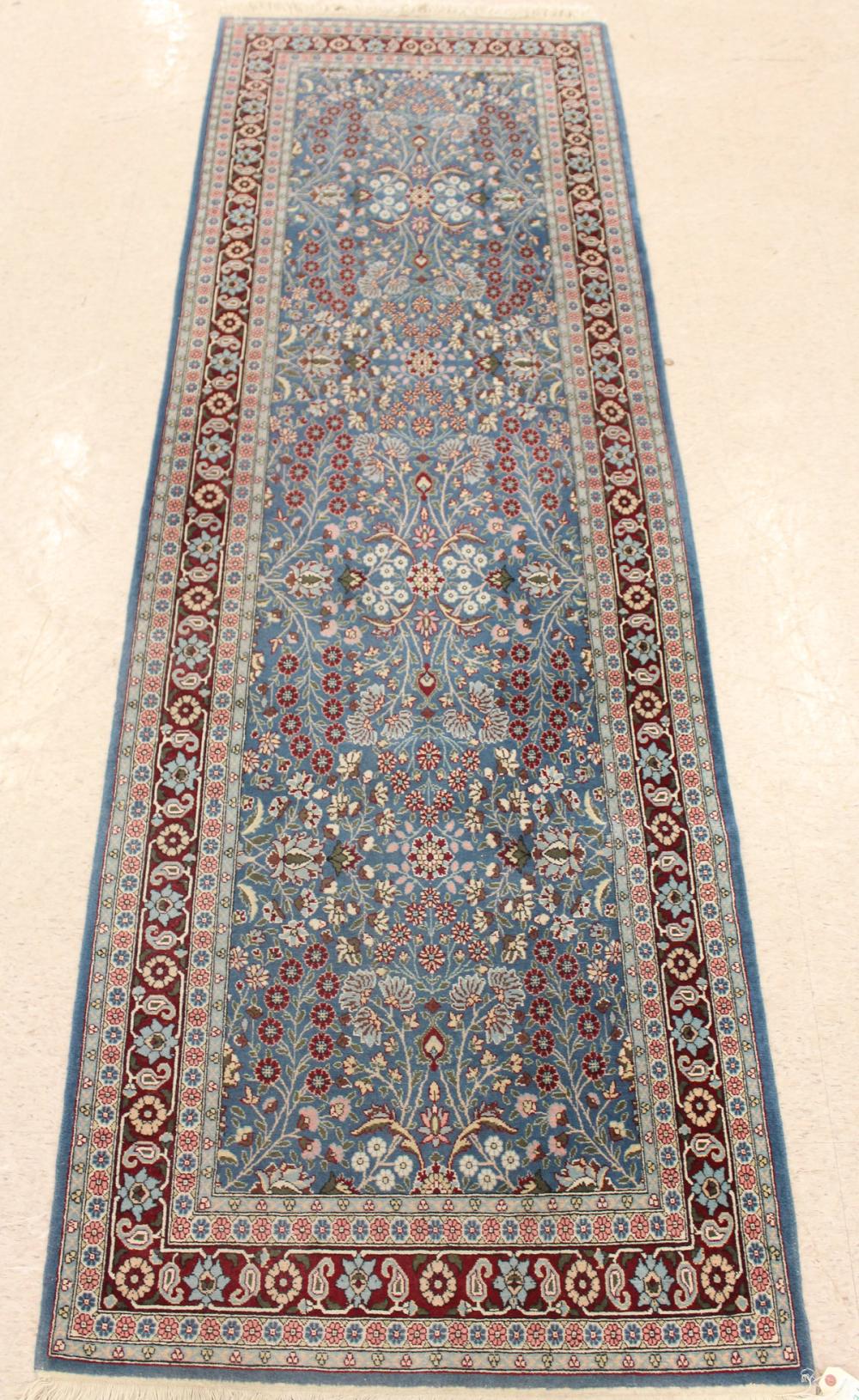 Appraisal: HAND KNOTTED ORIENTAL HALL RUG Indo-Persian overall floral vine motif