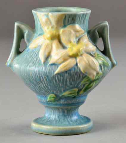 Appraisal: Roseville -Handled Vase with ClematisBlue vase with white clematis raised