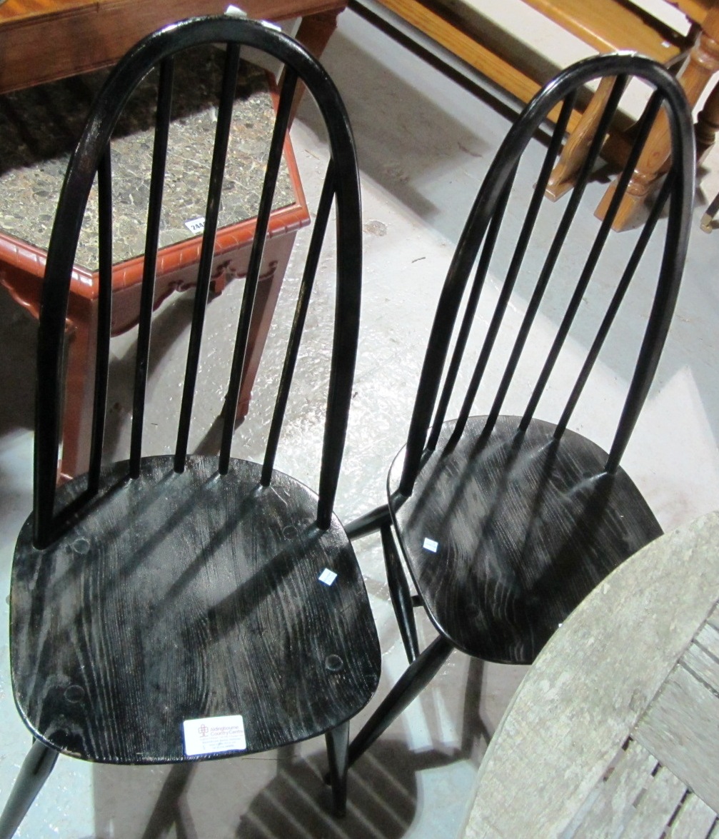 Appraisal: A pair of ebonised Ercol chairs and a Ercol plate