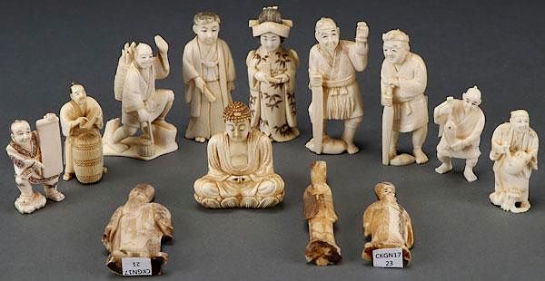 Appraisal: A GROUP OF JAPANESE CARVED IVORY OKIMONOS CIR A GROUP