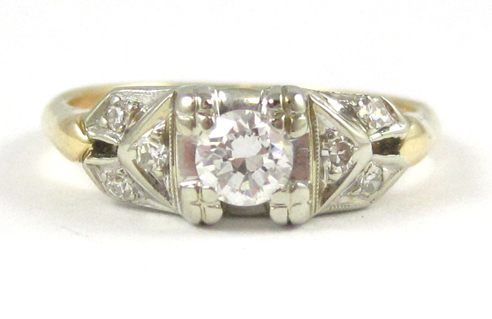 Appraisal: DIAMOND AND FOURTEEN KARAT GOLD RING The white and yellow