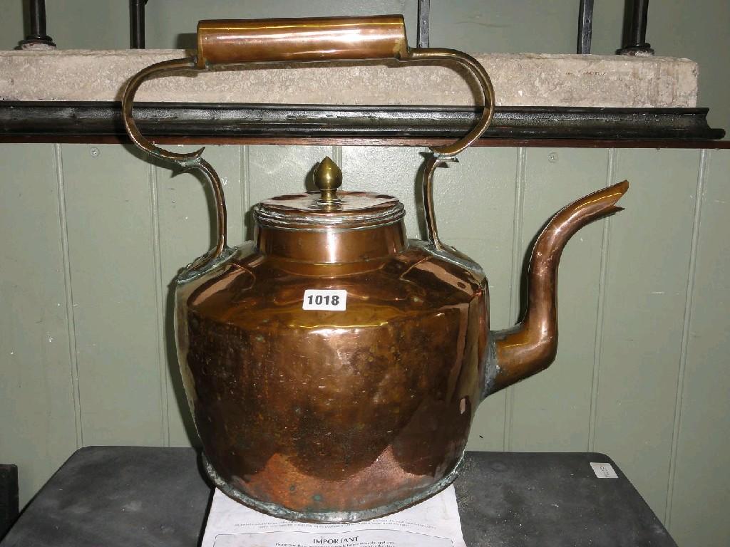 Appraisal: A large Victorian copper hearth kettle with shaped handle