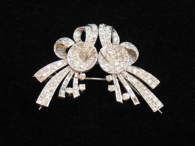 Appraisal: AN ART DECO DIAMOND BROOCH pave-set with round brilliant-cut and