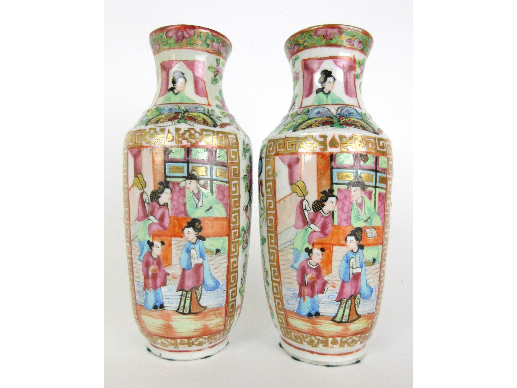 Appraisal: A pair of Cantonese famille rose baluster vasespainted with panels