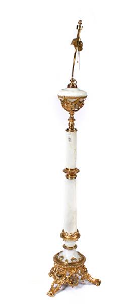 Appraisal: A gilt-bronze mounted onyx based torchere height to finial in