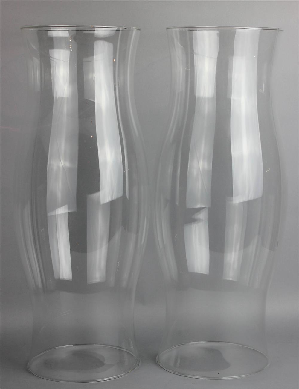 Appraisal: PAIR OF LARGE CLEAR GLASS HURRICANE SHADES of typical shape