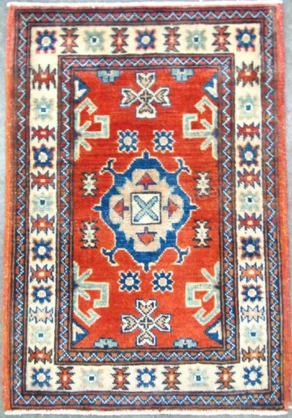 Appraisal: Handmade Oriental Area Rug Kazak design red field with blue