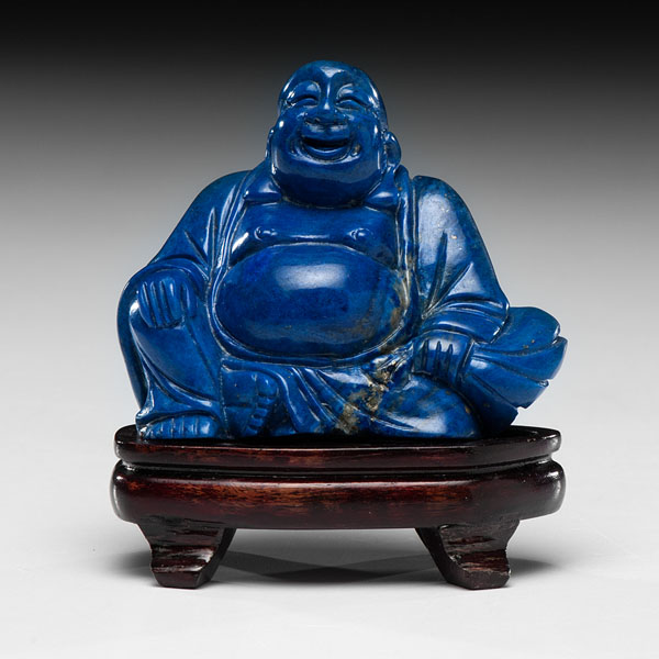 Appraisal: Chinese A carved lapis seated and laughing Buddha Ht in