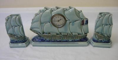 Appraisal: A SARREGUEMINES POTTERY ART DECO CLOCK GARNITURE the movement having