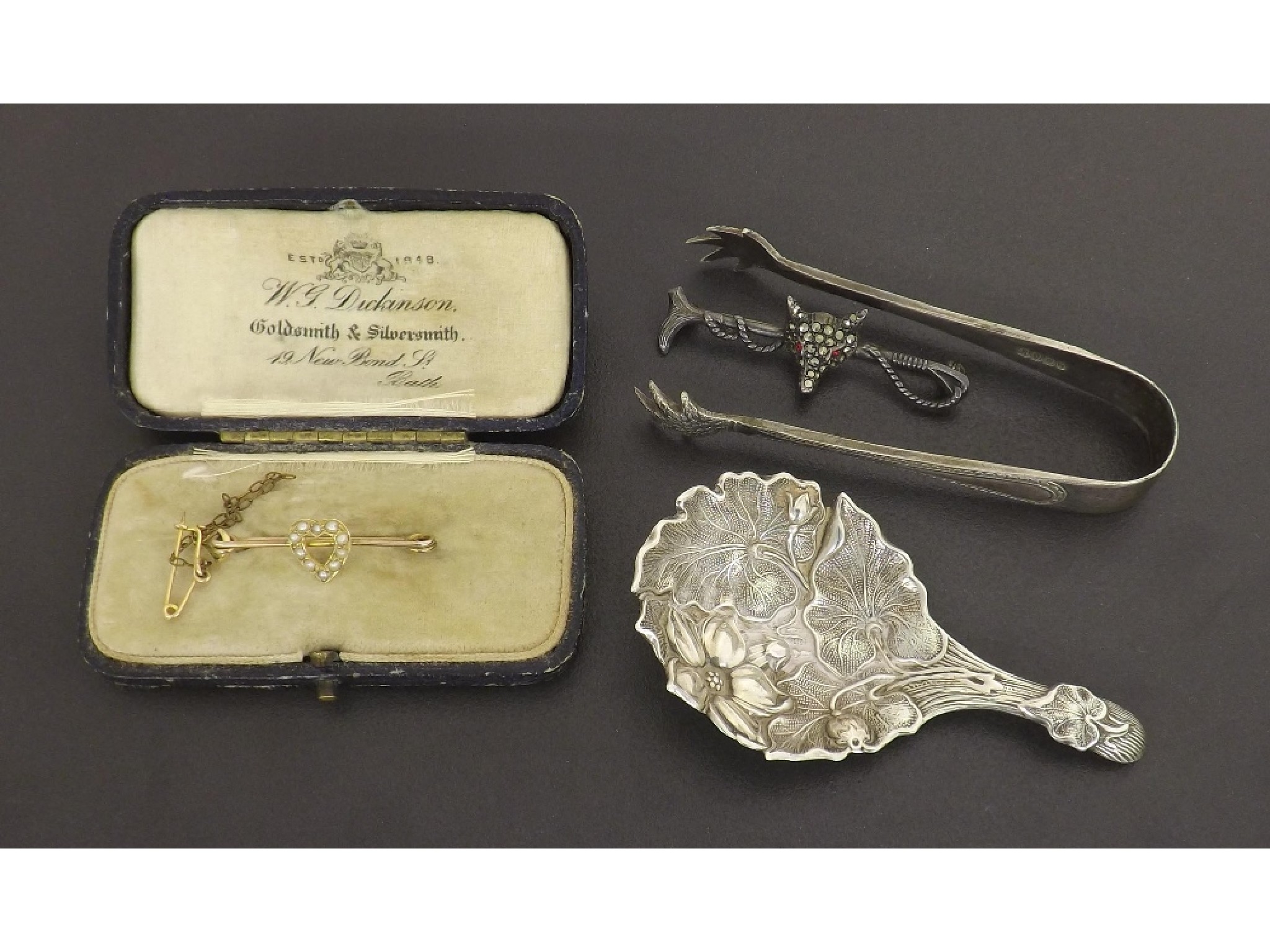 Appraisal: Victorian silver caddy spoon with embossed foliate decoration Sheffield maker