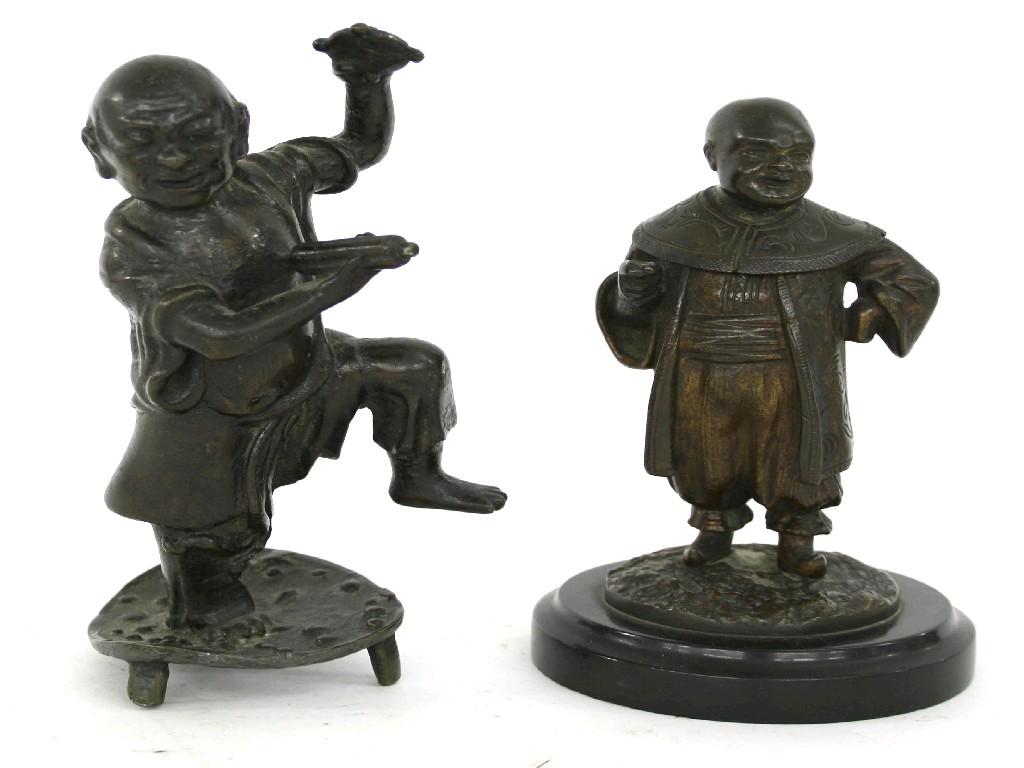 Appraisal: Oriental bronze figure of a gentleman in traditional robed attire