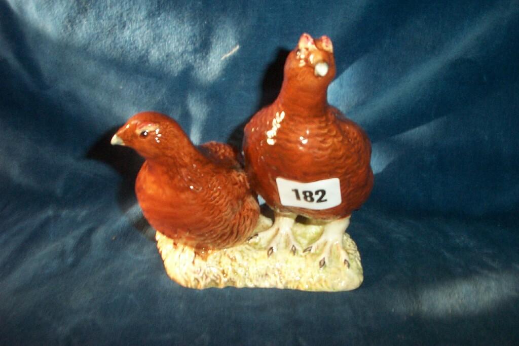 Appraisal: A Beswick group of a pair of red grouse with