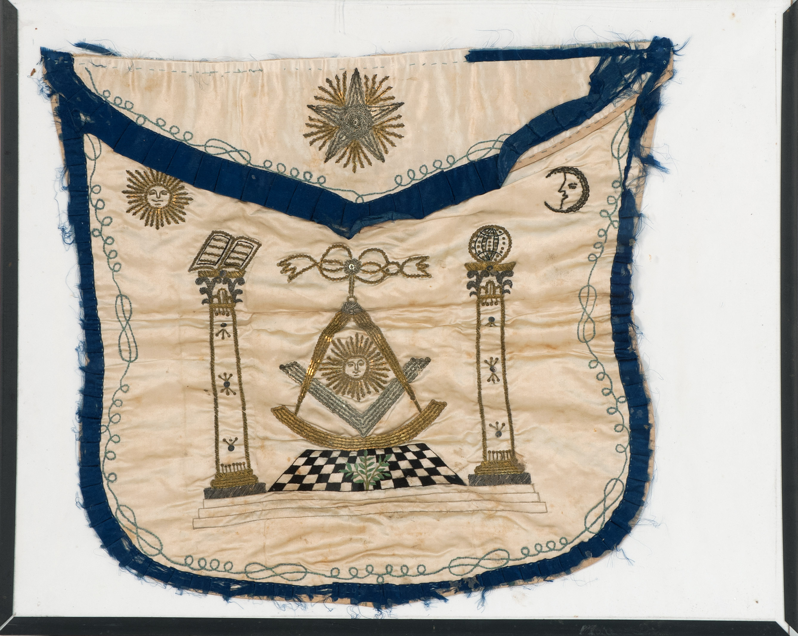 Appraisal: FRAMED MASONIC APRON In white silk with light blue embroidered