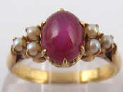 Appraisal: A yellow metal tests carat gold star ruby and seed