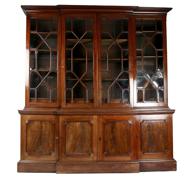 Appraisal: A GEORGE III MAHOGANY BREAK FRONT BOOKCASE the interior of