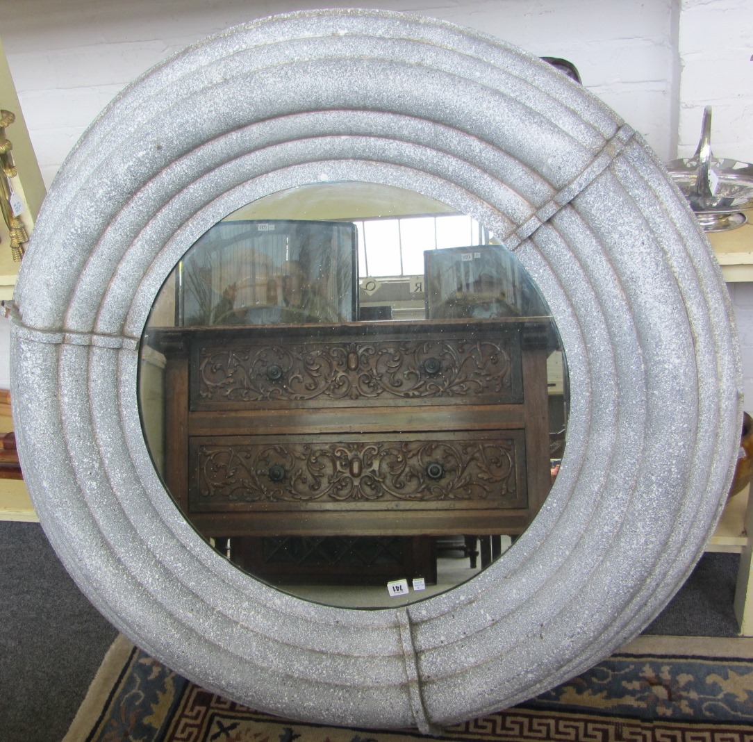 Appraisal: A th century circular metal wall mirror with faux painted