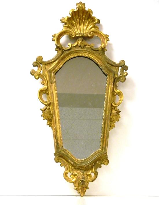 Appraisal: Gilt wall mirror with shell finial shield shape with pierced